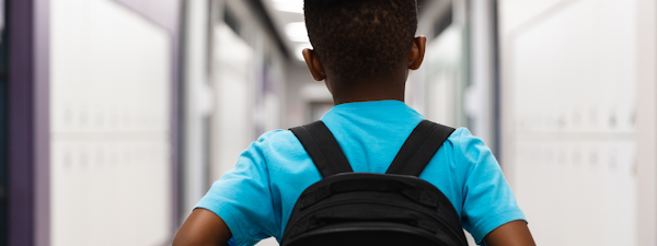 Boy in hallway returning to school