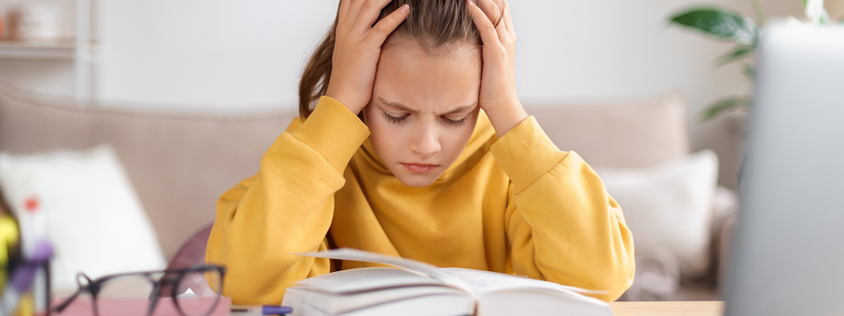 Middle school girl struggling with reading homework