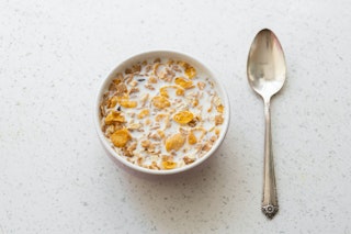 Milk and cereal with spoon