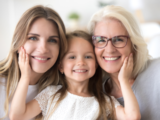 A daughter, mother, and grandmother smiling